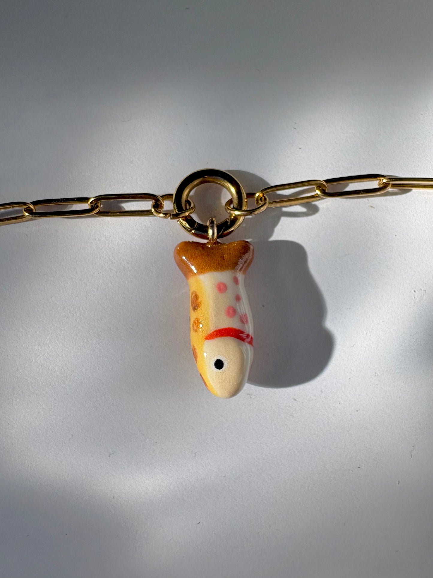 leopard trout charm necklace